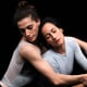 Lauren Flower, left, cradles Annia Hidalgo, while dancing together