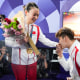 Liu Yuchen, left, proposes to Huang Yaqiong