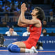 Image: India's Vinesh Vinesh, right, reacts to her win over Cuba's Yusneylis Guzman Lopez