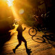 A woman jogs across the shimmering street.