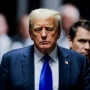 Donald Trump walks down the hall at Manhattan criminal court