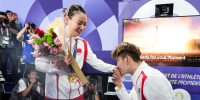 Liu Yuchen, left, proposes to Huang Yaqiong