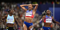 Gabby Thomas celebrates winning the women's 200m final of the athletics event at the Paris 2024 Olympic Games at Stade de France in Saint-Denis, north of Paris, on August 6, 2024.