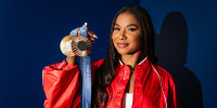 Jordan Chiles poses for a portrait holding her gold and bronze Olympic medals