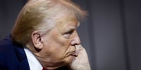 Donald Trump listens during a question and answer session