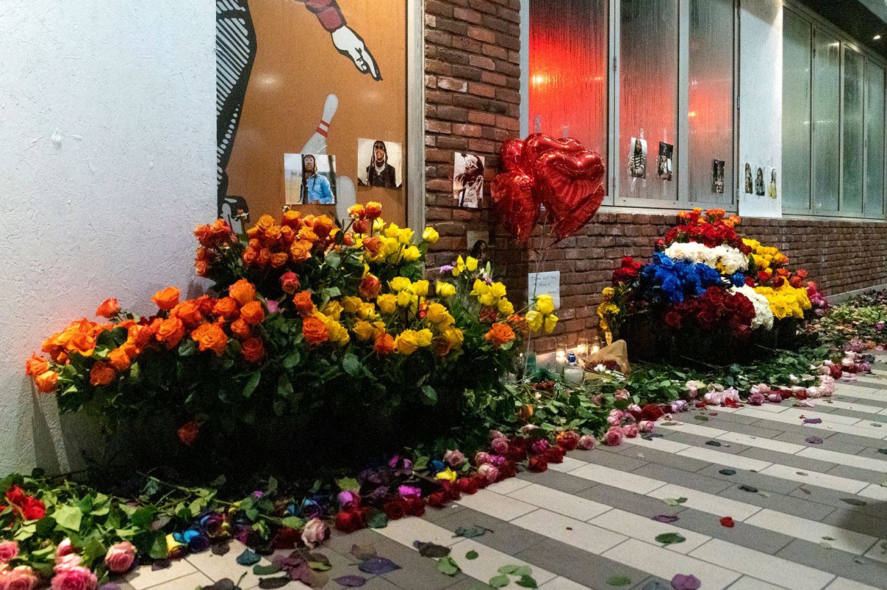 Flowers, balloons and candles are left near the site where Takeoff was shot in Houston, Texas. 