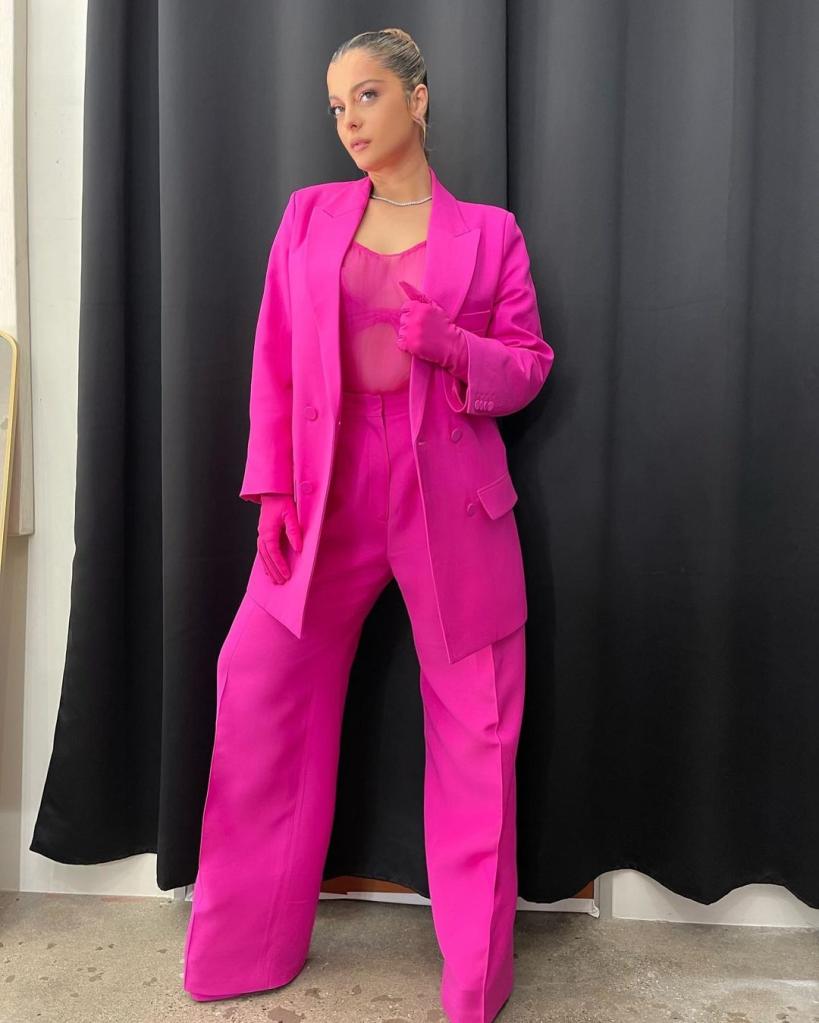 Bebe Rexha in a pink suit. 