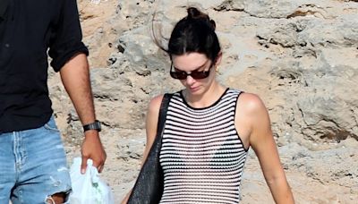 Kendall Jenner Puts a Luxe Spin on Beach Cover-Ups in a transparent Dress and Her Favorite Flip-Flops