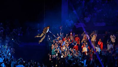 Tom Cruise crashes Paris Olympics closing ceremony with thrilling rappel, skydiving stunt