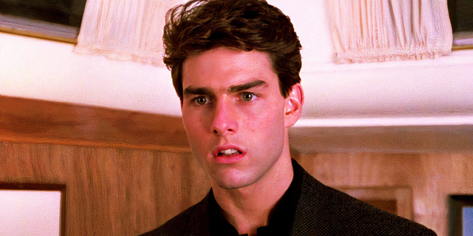 Tom Cruise looking serious as Brian in Cocktail