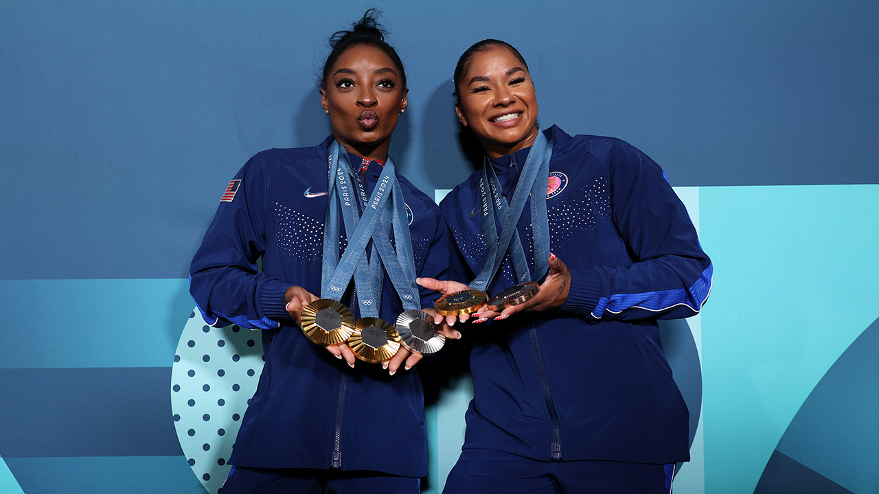 Simone Biles and Jordan Chiles of Team United States pose with their Paris 2024 Olympic medals following the Artistic Gymnastics Women's Floor Exercise Final on day ten of the Olympic Games Paris 2024 at Bercy Arena on August 05, 2024 in Paris, France.