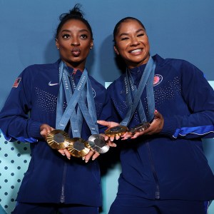 Simone Biles and Jordan Chiles of Team United States pose with their Paris 2024 Olympic medals following the Artistic Gymnastics Women's Floor Exercise Final on day ten of the Olympic Games Paris 2024 at Bercy Arena on August 05, 2024 in Paris, France.